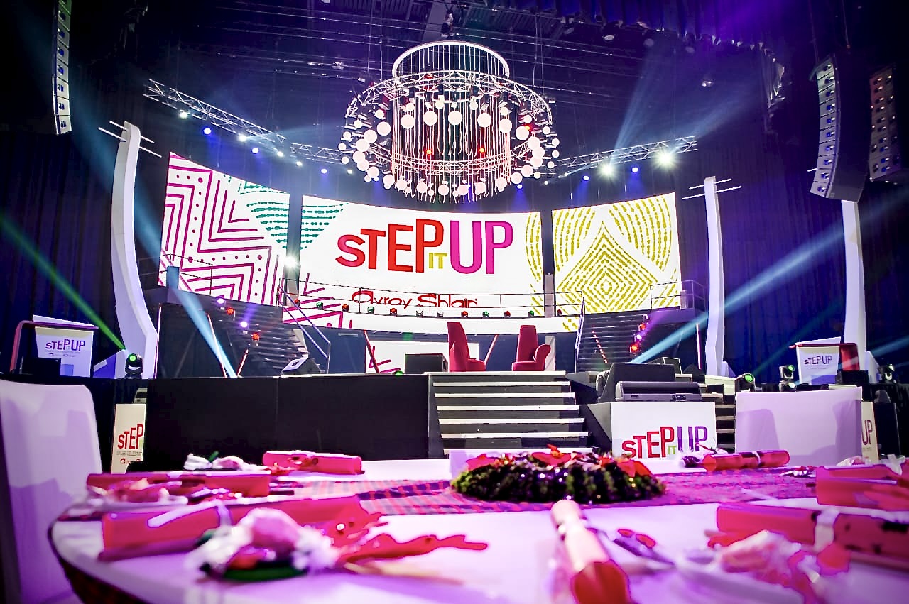 Corporate awards gala produced by Memories in Motion — multi-level stage with LED screens, draped staircase, tiered chandelier and dressed banquet tables
